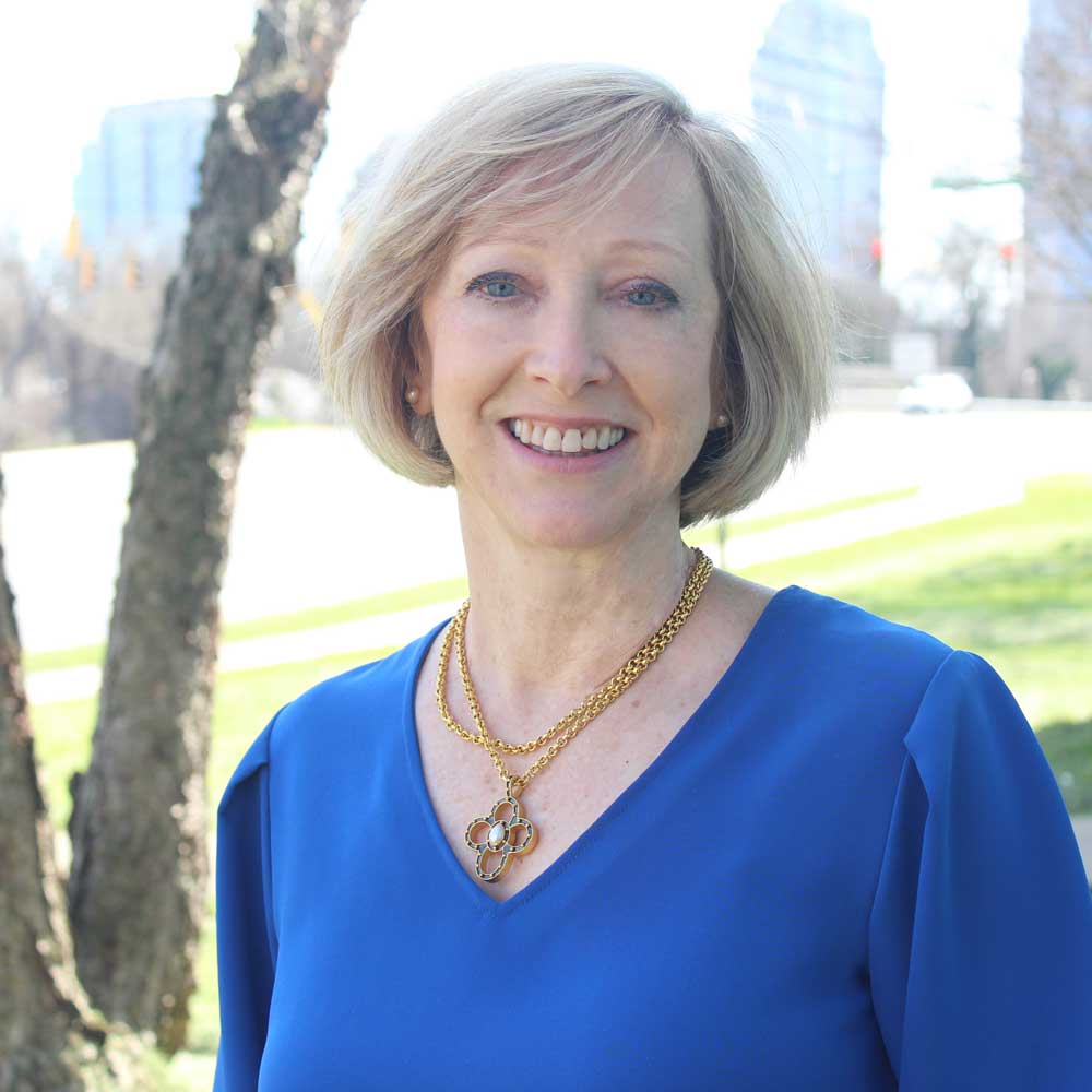 Carol Hardison Headshot Outside Crisis Assistance Ministry Building