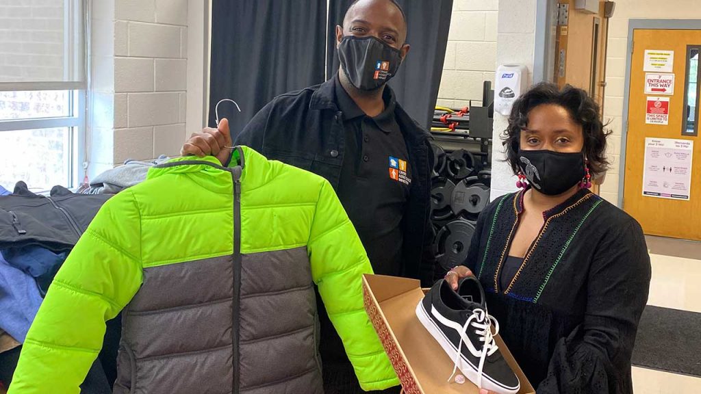 Crisis Assistance Ministry’s Phillip Miller (left) welcomes Raukell Robinson, Family and Community Engagement Manager for Charlotte Mecklenburg Schools’ Central 1 Learning Community, and staff from 29 CMS schools to shop for their students.