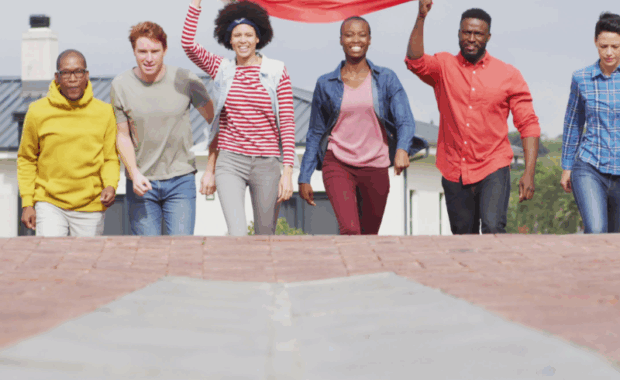 Still Image of Happy Group Of Diverse Male And Female Protesters Walking With Rainbow Flag