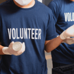 Picture of someone wearing a dark blue volunteer shirt.