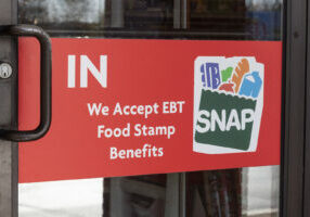 Ft. Wayne - Circa November 2021: SNAP and EBT Accepted here sign. SNAP and Food Stamps provide nutrition benefits to supplement the budgets of disadvantaged families.